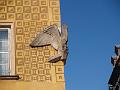 Some weird stone stork on a building corner